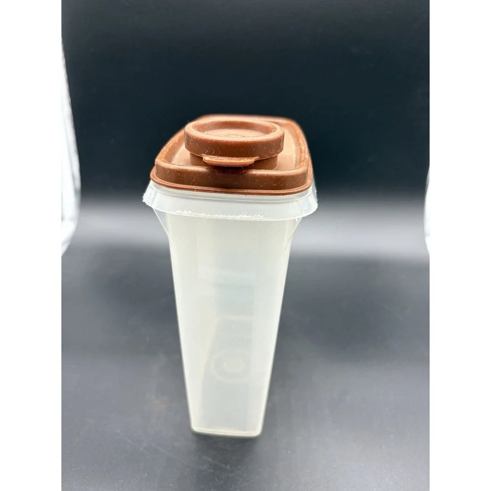 Vintage Mini Cereal Tupperware Container Bottom is 499-8 and‎ Top is 509-10.